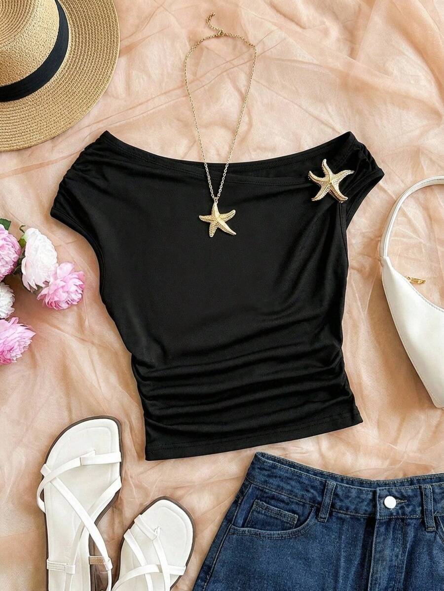 Top asimétrico de hombro negro y silueta corta de un hombro para niñas preadolescentes, con decoración de estrella de mar dorada, de tela suave y amigable con la piel, hombro oblicuo único y decoración exquisita, adecuado para ocasiones diarias/de moda ligera, sin restricciones y fácil de combinar, para crear un look fresco y elegante de niña - Negro - Ver 1