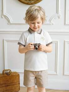 Souflis Souflis Ținută din 2 piese pentru băieți mici, include top cu guler polo și mânecă scurtă și pantaloni scurți asortați. Topul are design brodat, guler și manșete cu nervuri pentru un aspect rafinat. Pantalonii scurți din material texturat adaugă o senzație tactilă, perfecți pentru ieșirile de vară ale copiilor mici. - Multicolor - Vizualizare 8