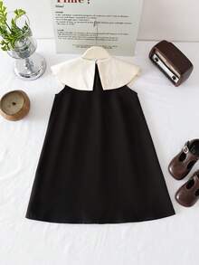 SHEIN 这款女童无袖连衣裙采用超大白色彼得潘领和蝴蝶结装饰，领口饰有珍珠纽扣，简约设计兼具可爱与优雅，适合夏季参加派对、聚会等轻度正式场合。 - 黑色 - 查看 3