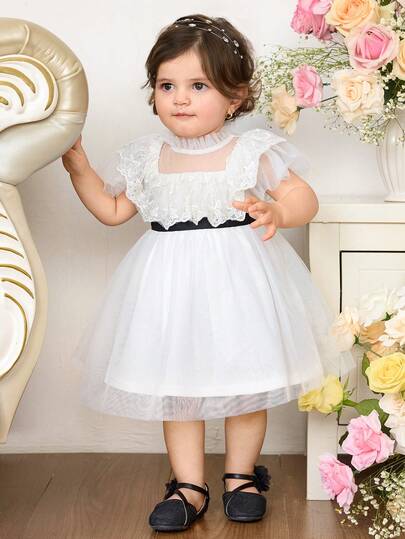 Đầm dự tiệc tay ngắn màu trắng bằng vải lưới thanh lịch và dễ thương cho bé gái.