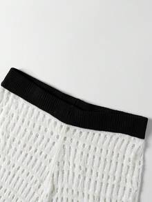 Breezaya Bộ đồ dệt kim cao cấp độc đáo mùa Xuân/Hè, áo vest dệt kim khoét rỗng phối màu trắng đen tương phản + quần short, họa tiết sao biển và vỏ sò. Độc đáo và bắt mắt, chi tiết màu sắc tương phản tinh tế. Kiểu dáng ôm sát tôn dáng, một bộ trang phục mùa Xuân/Hè độc đáo nhưng vẫn sang trọng. - Đen và trắng - Xem 4