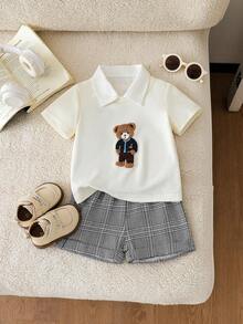 SHEIN Playful Pals 2件套婴儿幼儿男童休闲可爱卡通熊印花宽松短袖T恤和黑色短裤套装，适合日常穿着、户外玩耍、亲子活动、假日旅行。格子图案男童休闲短袖夏季套装，泰迪熊图案上衣，男童夏季套装，适合婚礼、迎婴派对、洗礼和一周岁生日庆祝等场合，也是送给宝宝的节日礼物。 - 白色 - 查看 8