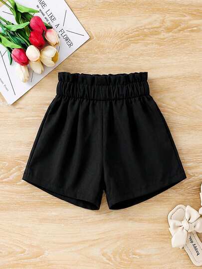 SHEIN Pantalones cortos negros con volantes de unicolor para niña, pantalones cortos tejidos elegantes y de moda, estilo universitario, excelentes para uso casual, diario y escolar en primavera y verano, a juego con mamá, hija y hermanas.