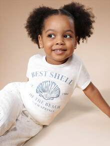 SUMWON 女童夏季海滩主题短袖圆领T恤，饰有贝壳印花和棕榈泉字样，休闲上衣 - 白色 - 查看 1