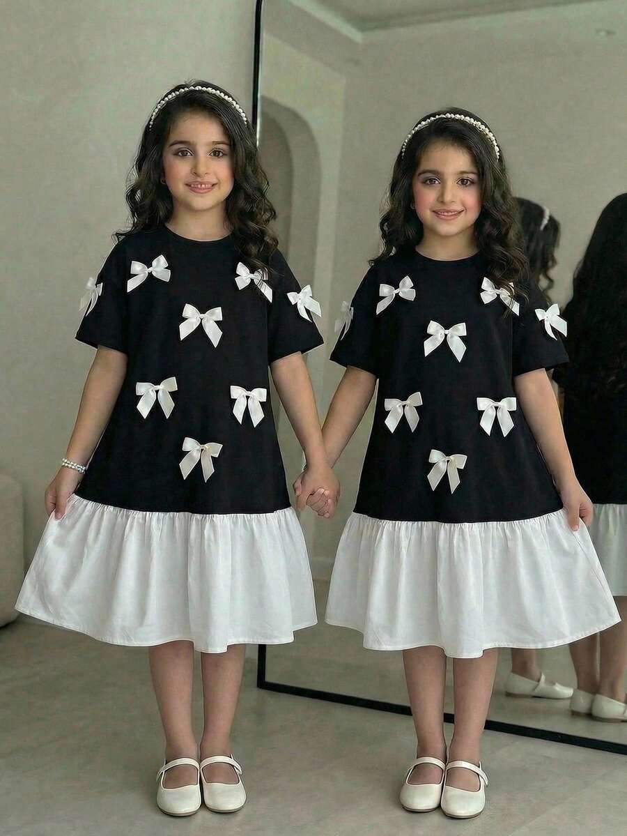 SHEIN Vestido midi casual para meninas pré-adolescentes com laço grande contrastante em preto e branco, modelagem solta e mangas curtas. - Preto e Branco - Ver 1