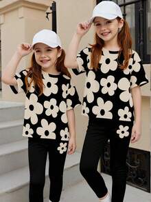 Bộ đồ cho bé gái gồm áo thun ngắn tay cổ tròn in họa tiết hoa tối giản dễ thương và quần legging đen, thích hợp cho các hoạt động mùa xuân/hè. - Nhiều màu - Xem 4