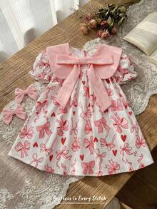 Cozy Pixies Đầm bé gái in hoa, cổ tròn, tay phồng, thắt eo, nơ to. - Nhiều màu - Xem 3