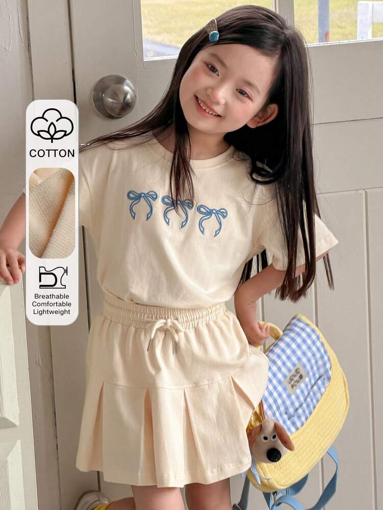 Young Girl Bow Print Round Neck Short Sleeve T-Shirt And Drawstring Waist Pleated Mini Skirt Casual Set Spring