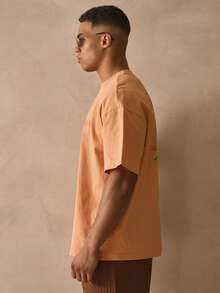 Musero Camiseta de cuello redondo de manga corta con hombros caídos y estampado floral gráfico de marca grande, esencial para primavera y verano - Naranja Coral - Ver 4