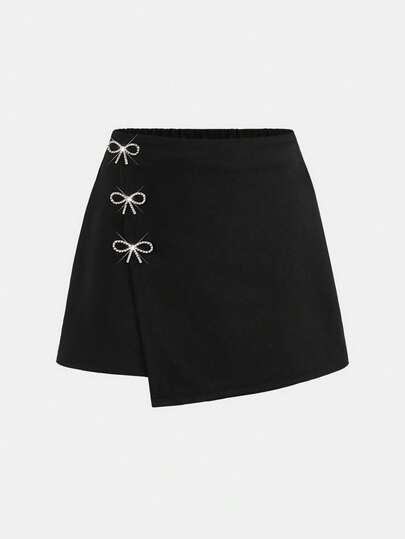 Girlism Tween Girls Black Solid Color Mini Skirt With Metallic Bow Decor, Versatile Urban Casual Commuter Skirt With Attached Shorts, Suitable For Any Occasion