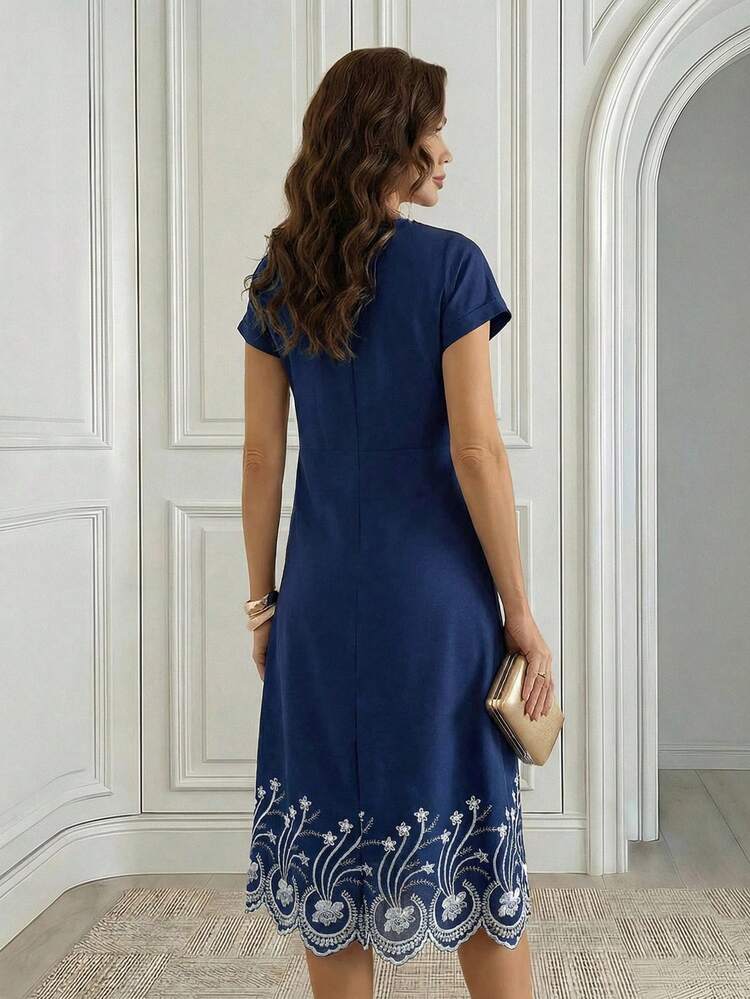 This Women's Casual Vacation Dress Features A Sophisticated Navy Blue Base With Delicate White Floral Embroidery At The Hem, Exuding A Touch Of Understated Luxury. The Floral Pattern Is A Delicate Botanical Embroidery Design, Conveying An Elegant And Understated Style. The Dress Features A Round Neck, Short Sleeves, A Leather Belt To Cinch The Waist, And A Midi Skirt. The Draping And Breathable Fabric Is Versatile And Suitable For Various Occasions. The Belt Design Flatters The Figure, Creating A Sleek And Stylish Look. Perfect For Summer, This Dress Is Suitable For Everyday Commutes, Casual Gatherings, Or Elegant Afternoon Tea. The Navy Blue Base Conveys A Sense Of Composure, While The Embroidered Details Showcase Fashionable Taste, Making It A Practical And Stylish Addition To Any Summer Wardrobe. ,Summer Dress,Spring Dresses For Women