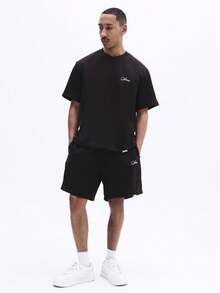 SUMWON Conjunto de camiseta de manga corta y pantalones cortos a juego con detalles de logo pequeño para uso casual de verano, en color negro - Café integral - Ver 1