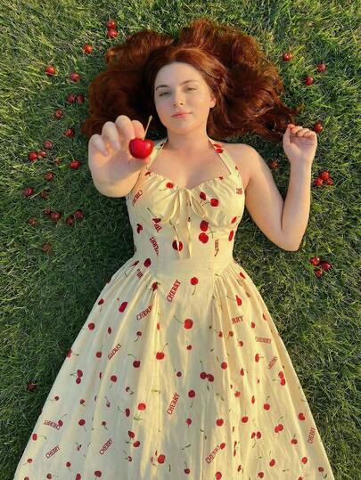SHEIN MOD Plus Size Yellow Halter Umbrella Dress, Cherry Fruit Print Mid-Length Dress, Romantic Vacation Umbrella Dress.Plus Size Yellow Cherry Print Dress Halter Neckline Sweetheart Bodice Flared Midi Skirt Ruched Bust Vintage-Inspired Style Bow Tie Back Fitted Waist Soft Sheen Lightweight Fabric Playful Pattern Bright Red Accents Feminine Silhouette Elegant Drape Classic Charm Retro Look Gathered Detail Smooth Finish Summer Vibes