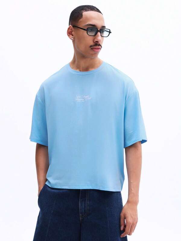 SUMWON Camiseta de algodón de corte relajado con pequeño logo impreso en el pecho, de manga corta, cuello redondo, básica de verano para uso diario y comodidad