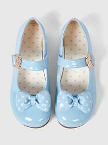 Sky blue bright leather + polka dot bow.