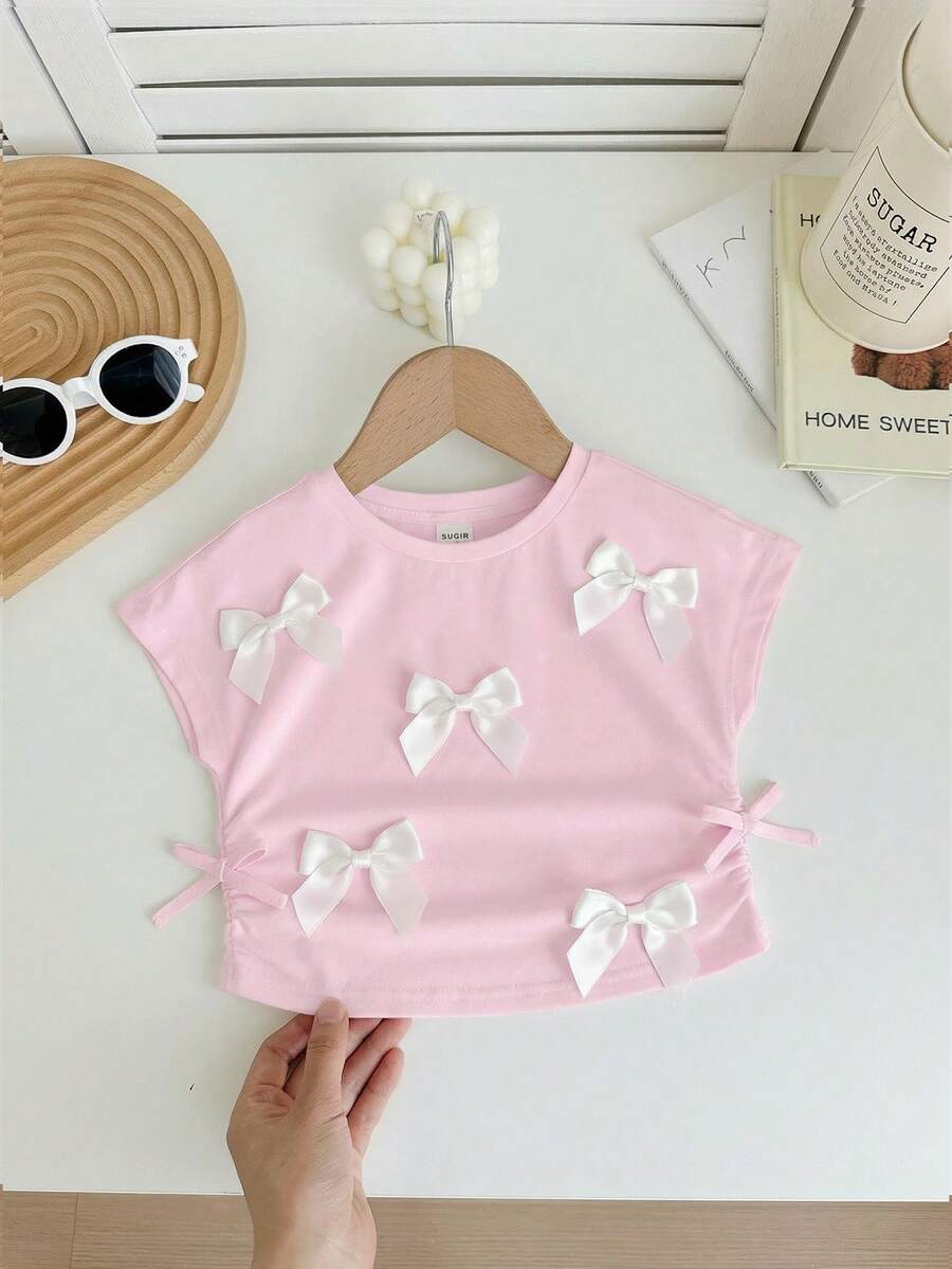SHEIN LMoss Kids 可爱休闲百搭白色蝴蝶结针织短袖上衣,夏季粉色女宝宝上衣,优雅女宝宝蝴蝶结T恤 - 粉色 - 查看 1