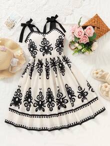 Đầm hồng thanh lịch cho bé gái tuổi teen, họa tiết hoa hồng, dây mảnh, vai bèo nhún và nơ, dáng chữ A, thích hợp cho kỳ nghỉ, đi học, dã ngoại, mùa xuân/hè. - màu đen - Xem 4