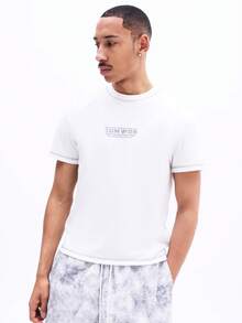 SUMWON Camiseta de cuello redondo de manga corta con ajuste muscular y estampado de logotipo en el pecho, uso casual de verano, uso diario, cómoda camiseta de algodón - Blanco - Ver 1