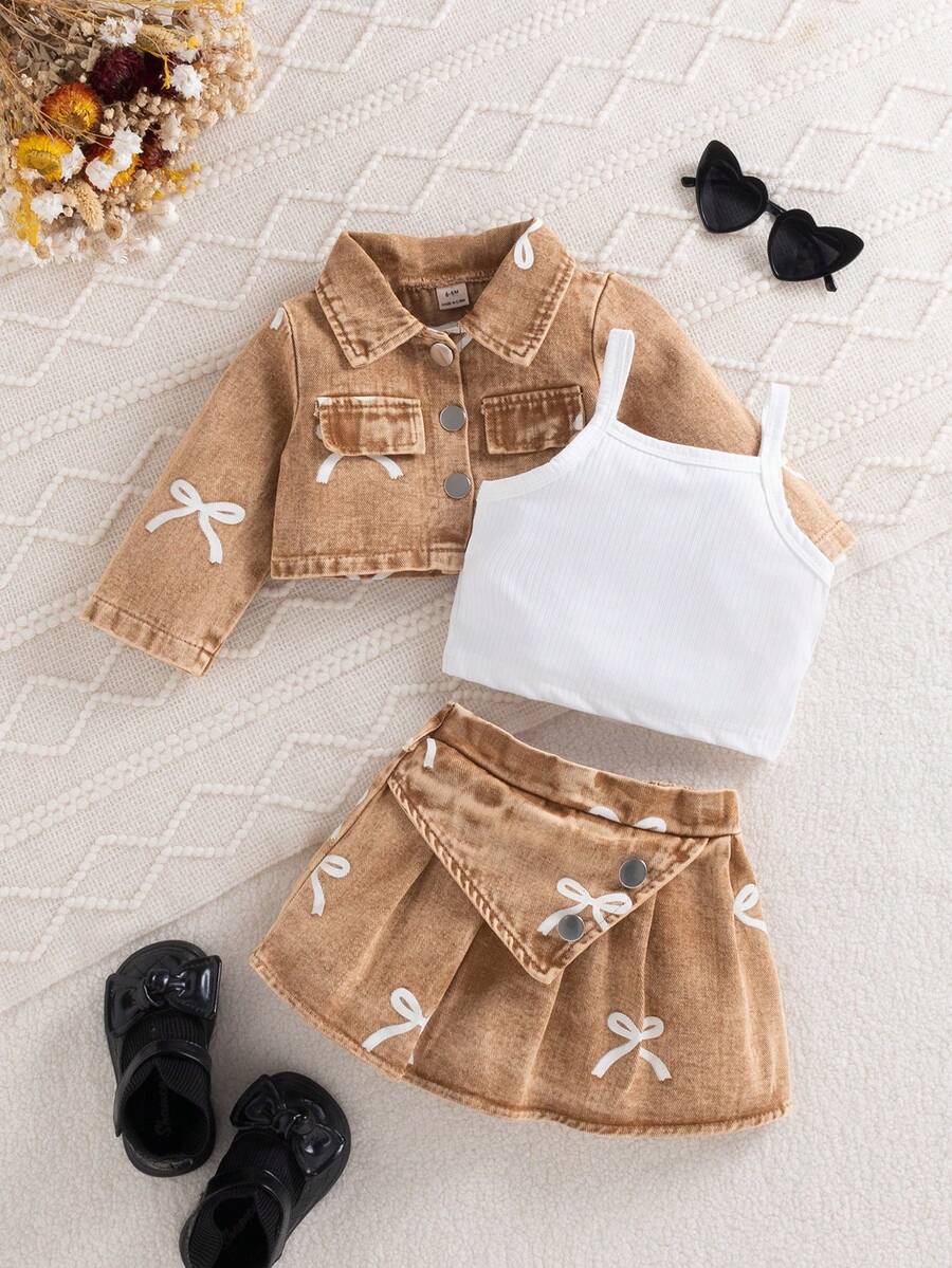 SHEIN 3pcs Baby Girl Spring/Autumn Fashion Sweet Street Style Blue Long Sleeve Denim Jacket With Printed Bow, Matching Blue Denim Skirt And White Camisole Top, Suitable For School, Photography, Street Wear - Khaki - View 1