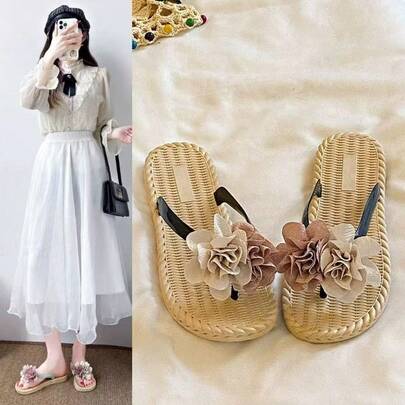 Zapatillas de playa geniales ropa exterior de verano para mujer 2026 nuevo estilo de hadas flor plana cómoda chanclas de una palabra zapatillas de vacaciones