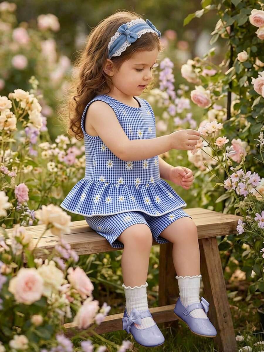 Elladie kids 两件套女童休闲时尚新款T恤套装,蓝白格子梭织面料,白色花卉数码印花圆领无袖T恤上衣,下摆设计精美;搭配蓝白格子白色花卉数码印花短裤,适合年轻女孩穿着,可爱、休闲、舒适,适合日常上学、郊游、海滩度假、派对等场合。春夏蓝色连衣裙,适合儿童穿着。蓝色春季女童连衣裙。长春花色女童服装。优雅派对礼服。 - 藍色 - 查看 1