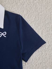 Sparklyn 这款少女休闲运动套装，采用撞色缝线 Polo 领设计，胸前饰有刺绣，短袖上衣腰部设有褶裥，搭配阔腿抽绳裤。这款藏蓝色运动套装完美兼顾舒适与时尚。精致而不张扬，可调节腰围的阔腿裤和撞色 Polo 领更能衬托颈部线条。是居家休闲、运动健身或户外活动的必备夏季单品。 - 藏蓝色 - 查看 9