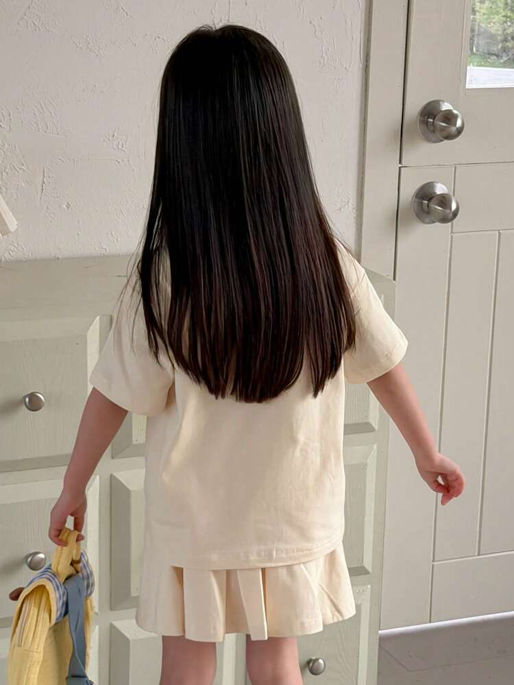 Young Girl Bow Print Round Neck Short Sleeve T-Shirt And Drawstring Waist Pleated Mini Skirt Casual Set Spring