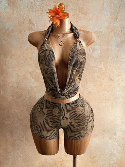 Mistrie Women's Animal Print Leopard Halter Top With Front Tie, Featuring Metal Ring Details And Cut-Out Design. Fashionable And Sexy Halter Backless Leopard Vest, Suitable For Vacations, Parties, And Music Festivals.