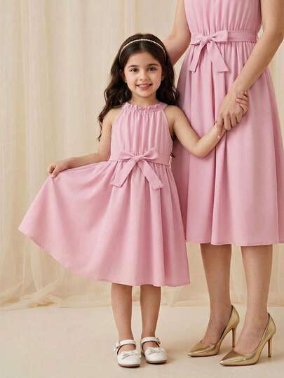 SHEIN Young Girl Summer Solid Color Halter Neck Casual Dress Junior Bridesmaid Dress Dusty Pink Dresses For Kids Bridesmaids Pink Dress For Girls Elegant Pink Bow Girls Dress Pink Dresses For Kids Pink Bow Dress Girls Pink Dress Pink Halter Neck Dress Girls Bridesmaids Pink Dress For Gilrs Elegant Pink Dress Mommy And Me Pink Dress Pink Elegant Dresses For Kids Mauve Dress For Kids Light Pink Junior Bridesmaid Dress Pink Bow Dress For Girls