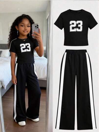 SHEIN Sparklyn Girls' Oversized T-Shirt Set, Black Sports Letter Graphic Loose Tee And Wide Leg Pants, Soft Knit Fabric, Suitable For Casual, Sports And Vacation Wear, New Summer Collection