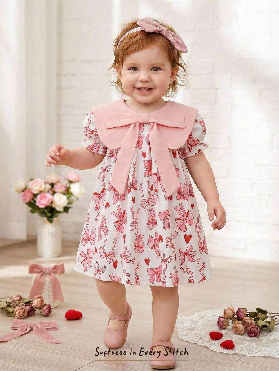 Cozy Pixies Đầm bé gái in hoa, cổ tròn, tay phồng, thắt eo, nơ to. - Nhiều màu - Xem 1