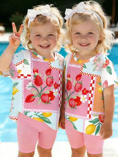 春夏女童休闲时尚创意个性清新可爱简约草莓、柠檬、桃子、树叶、格子图案印花短袖T恤和粉色骑行短裤套装，舒适百搭，适合春、夏、秋季穿着。