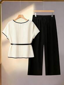 GlowEve CURVE Conjunto informal de 2 piezas para mujer talla grande con camisa de cuello redondo en color albaricoque con ribete de contraste y manga corta, y pantalón ancho y suelto de pierna ancha en color negro - Albaricoque - Ver 2