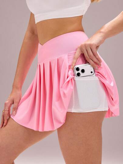 Core Rhythm Women's Solid Color Overlap Waist Pleated Hem Sports Skorts