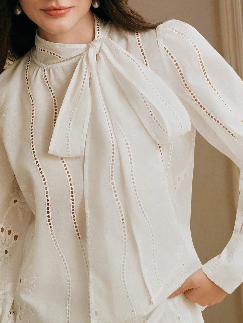 Anewsta Spring New Design Hollow Embroidery Solid Color Ribbon Long Sleeve Blouse For Women