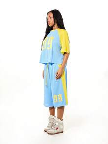 SUMWON WOMEN Women's Oversized Basketball Mesh Shorts With Contrast Panel Yellow Striping And Graphic Logo Design For Street Style Summer - Blue - View 5