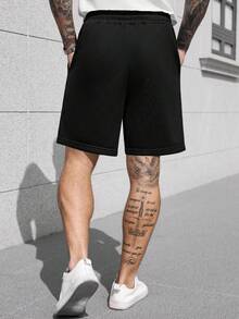 Manfinity CasualCool Men's Street Style Drawstring Shorts, Loose Minimalist Large Font Letter Embossed Shorts - Black - View 2