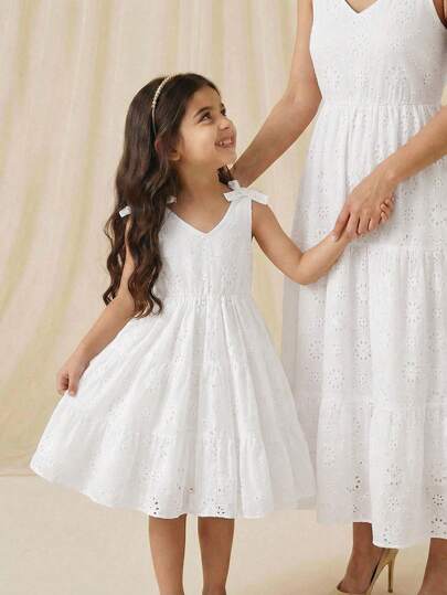 SHEIN Vintaside Kids White Lace Bowknot Sleeveless V-Neck Hollow Embroidery Floral Midi Dress, Suitable For Young Girls Daily, Beach Vacation, Afternoon Tea With Friends, And Elegant Fairy Style