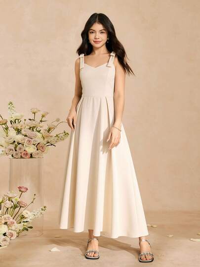 SHEIN 优雅针织连衣裙，适合少女穿着，浪漫无袖蝴蝶结下摆，日常穿着及各种场合皆宜，春夏款。