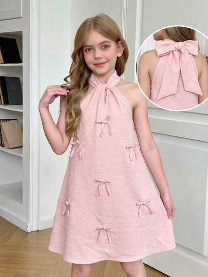 SHEIN 少女优雅纯粉色露背吊带蝴蝶结装饰A字无袖连衣裙，适合休闲、日常穿着、上学、度假、派对、生日、情人节、婚礼等场合，尽显公主风范。