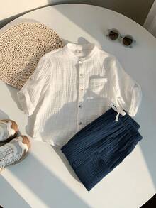 SHEIN 两件装男童休闲运动度假套装，包含一件白色翻领短袖衬衫和一条带松紧腰带口袋的纯色长裤，适合儿童穿着，也适合小男孩、返校季、生日派对、晚宴、演出、婚礼、情人节等场合，以及日常穿着、上学、旅行、运动、春夏季节。 - 藏蓝色 - 查看 5