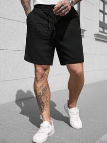 Manfinity CasualCool Men's Street Style Drawstring Shorts, Loose Minimalist Large Font Letter Embossed Shorts - Black - View 1