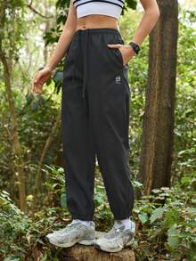 Exploreva Women's Drawstring Waist Pockets Casual Outdoor Running Pants - Black - View 3