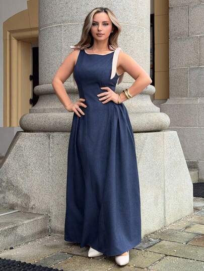 Jeta Ari 圆领无袖撞色滚边蝴蝶结装饰腰部喇叭下摆藏蓝色连衣裙