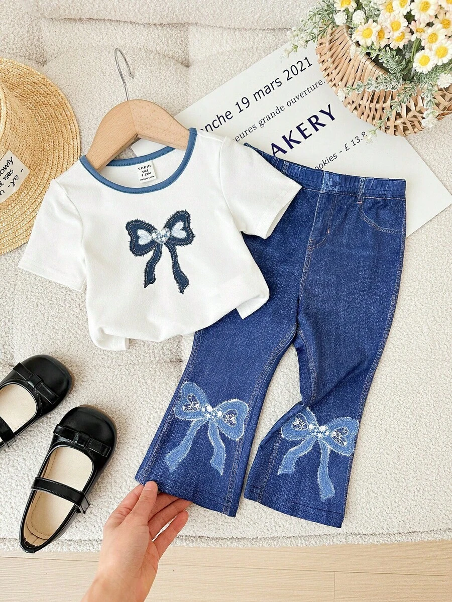 SHEIN Cute Baby Girl Fashion Knit White Round Neck Bow Print Short Sleeve Knit T-Shirt And Faux Denim Print Flare Pants Set Denim Set For Baby Girl Toddler Bow Outfit Toddler Big Bow Shirts Bow Baby Outfits Flare Bow Outfit Girls,Kids - White - View 1