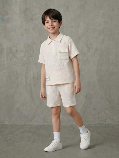 SHEIN Casuvi Kids 2 piezas Conjunto informal minimalista de niño pequeño con camisa de hombros caídos y pantalones cortos holgados, Beige - Camisa con cuello y escote medio abierto, Pantalones cortos de ajuste relajado, Adecuado para la escuela, reuniones de fin de semana, vida urbana