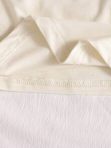 少女休闲个性吊带背心，黑白面料，不对称吊带下摆，适合旅行、度假、散步、外出，可搭配裤子、短裤、裙子、外套。 - 杏色 - 查看 5