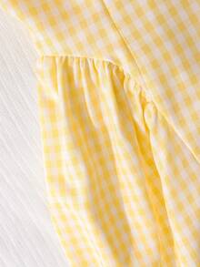 SHEIN Elladie kids 这款少女清新黄色格子吊带连衣裙，采用黄白小格子面料，搭配方领和蝴蝶结肩带装饰，散发着法式甜美气息。收腰设计和独特的剪裁，更添休闲时尚感。它是近年来流行的精致女装，适合夏季日常穿着。 - 黃色 - 查看 7