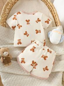 SHEIN Bộ 2 món áo thun ngắn tay và quần short in hình gấu hoạt hình dễ thương cho bé trai, nhẹ và thoải mái, phù hợp mặc hàng ngày, dự tiệc, cho bé 0-1 tuổi, mẫu mới mùa hè. - Màu be - Xem 5