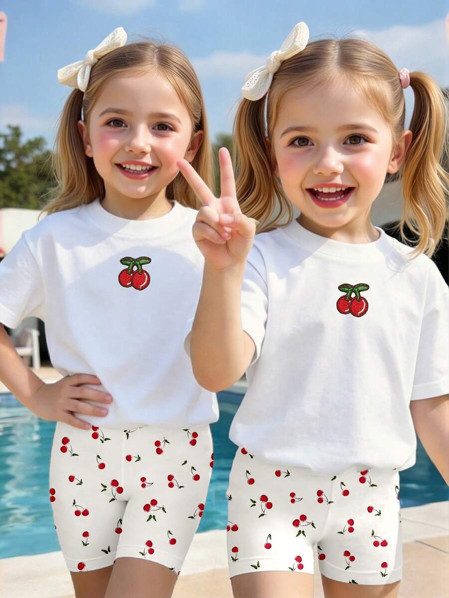 SHEIN Bộ đồ thể thao mùa xuân hè cho bé gái, phong cách thường ngày, sáng tạo, cá tính, tối giản, màu trắng với họa tiết lá và quả anh đào, gồm áo thun và quần short đạp xe, trang phục thoải mái. - Nhiều màu - Xem 1